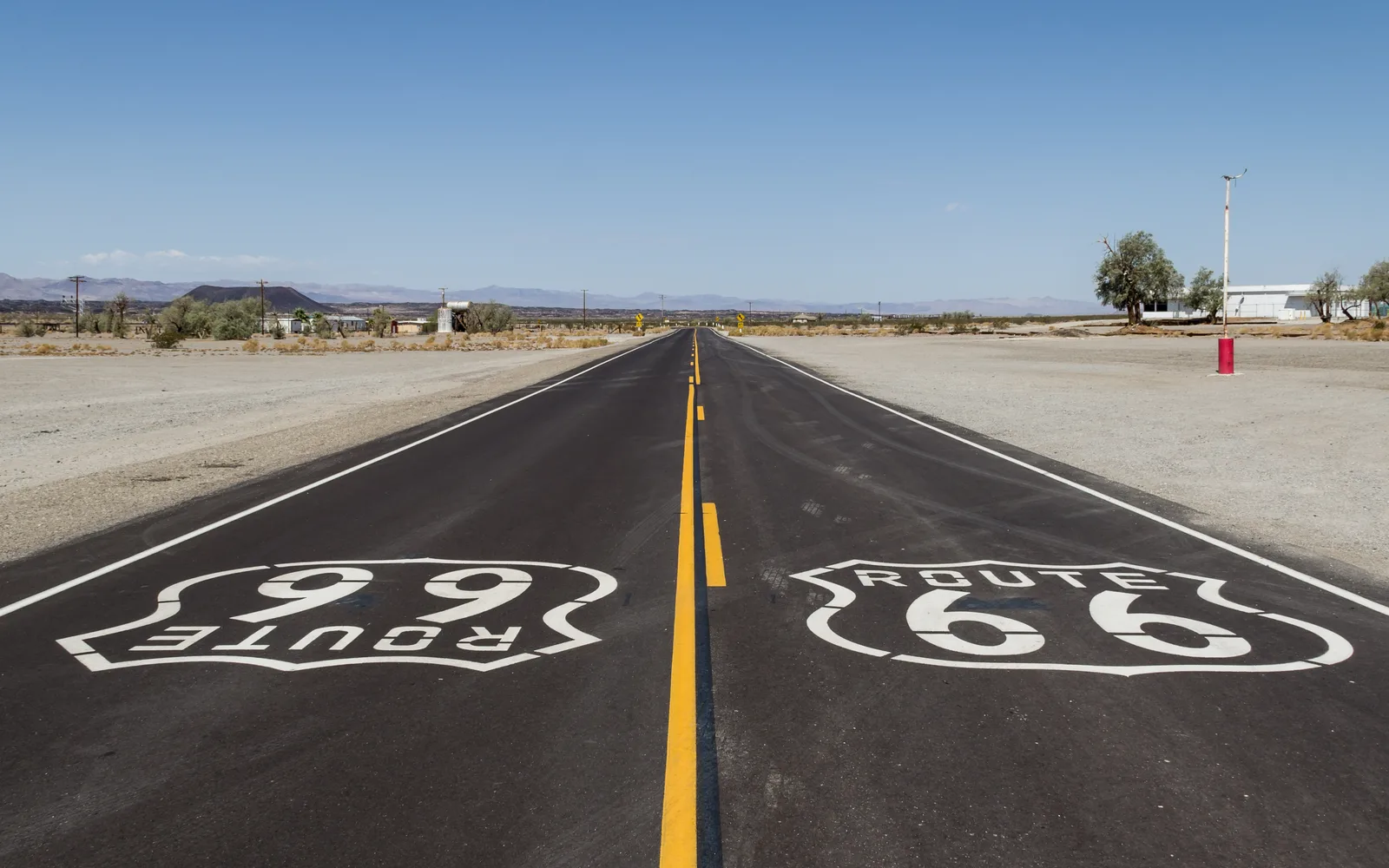 Historic Route 66 pavement and signage in Amboy, California, near San Bernardino